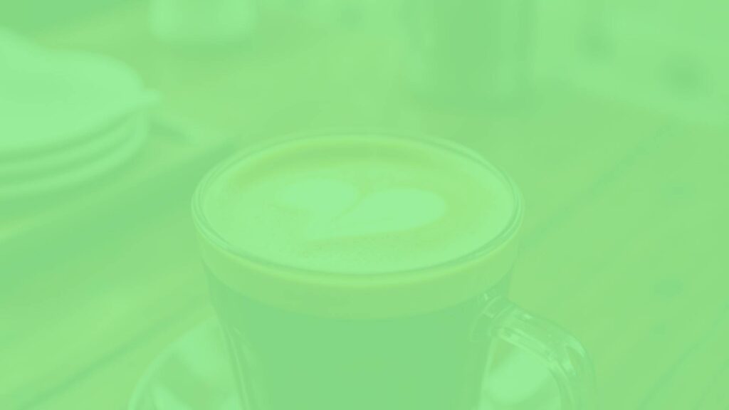 A close-up of an Italian macchiato coffee, rich espresso with a dollop of milk foam, steam rising, rustic wooden table background, warm lighting, realistic.