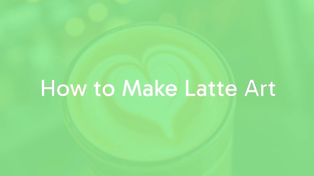 A close-up of a latte with heart-shaped art, creamy foam on dark espresso, warm coffee shop lighting, realistic.